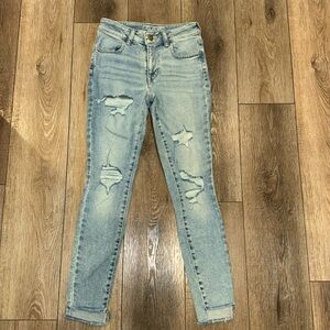 High waisted distressed jeans